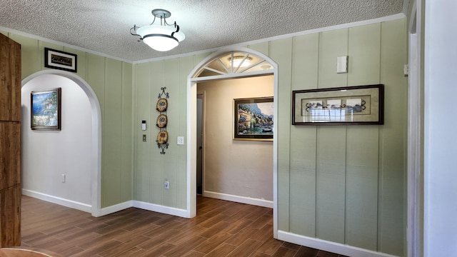 hallway with dark hardwood / wood-style floors and a textured ceiling