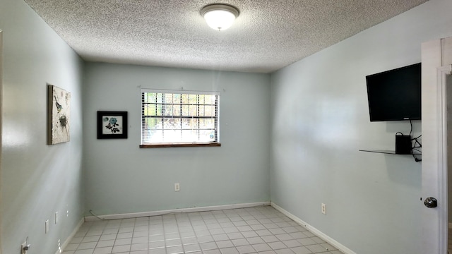 empty room with a textured ceiling