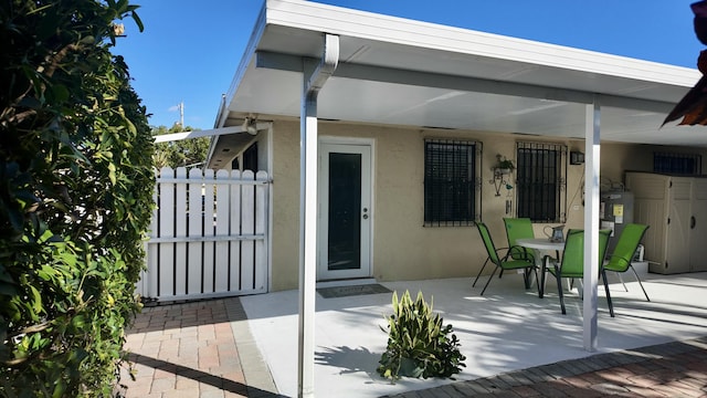 exterior space with a patio area and water heater