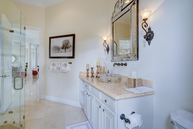 bathroom featuring vanity, tile patterned flooring, crown molding, and walk in shower