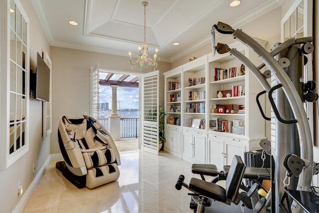 exercise room with light tile patterned flooring, ornamental molding, a chandelier, and a raised ceiling