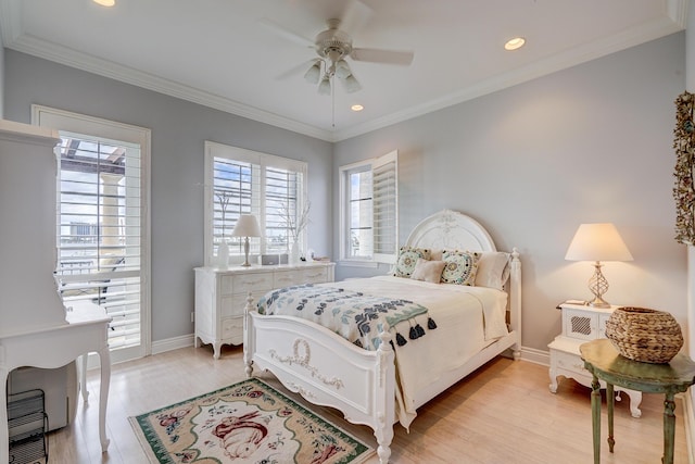 bedroom featuring crown molding, ceiling fan, and light wood-type flooring