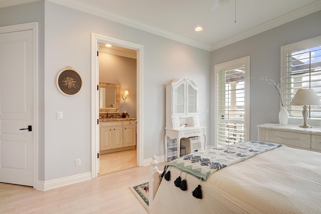 bedroom with multiple windows, ensuite bath, light hardwood / wood-style flooring, and ornamental molding