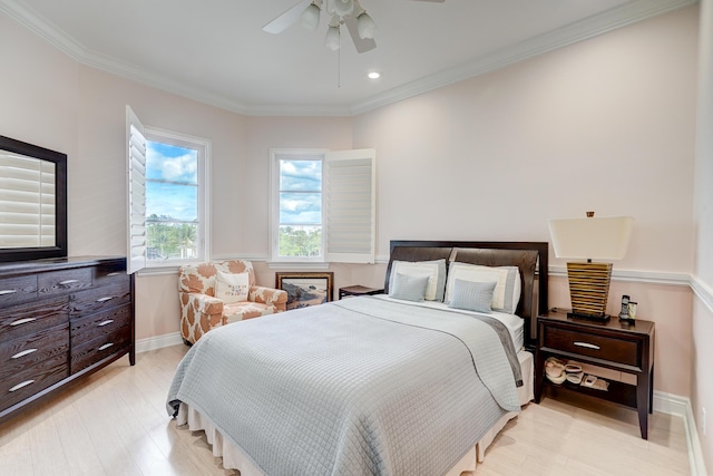 bedroom with crown molding, ceiling fan, and light hardwood / wood-style floors