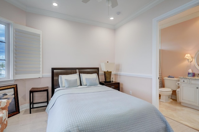 bedroom with crown molding, connected bathroom, and ceiling fan