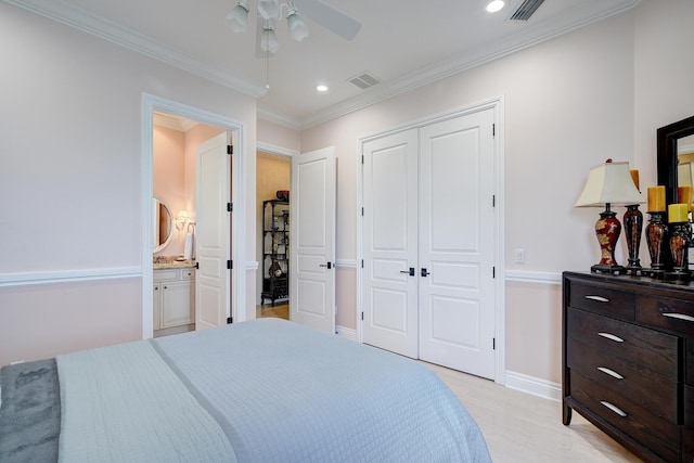 bedroom with ensuite bath, ceiling fan, light hardwood / wood-style floors, ornamental molding, and a closet