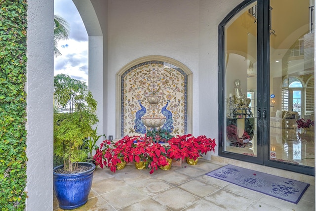 entrance to property featuring french doors