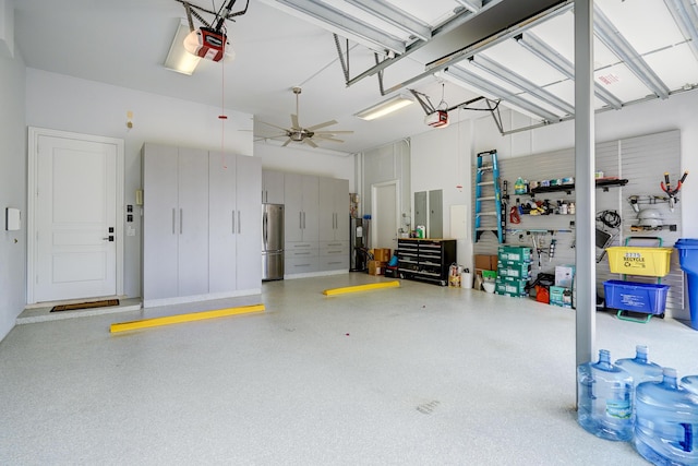 garage with stainless steel refrigerator and a garage door opener