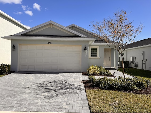 single story home with a garage