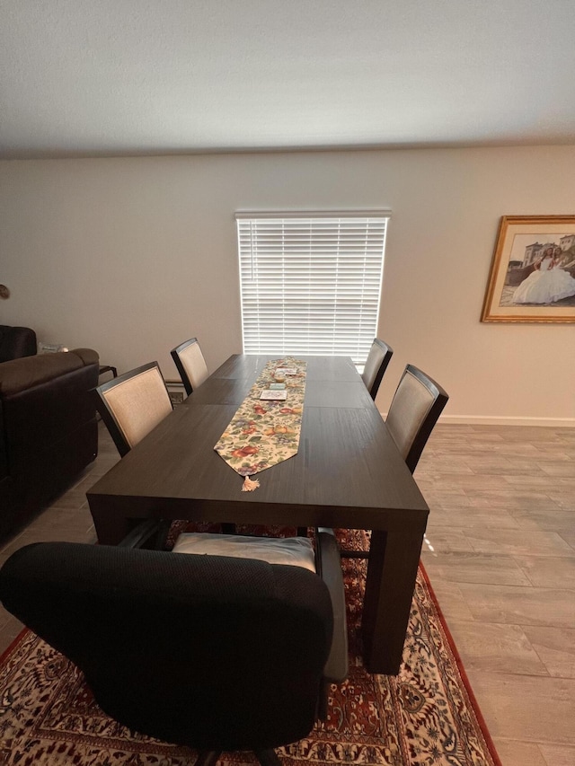 dining area with hardwood / wood-style floors