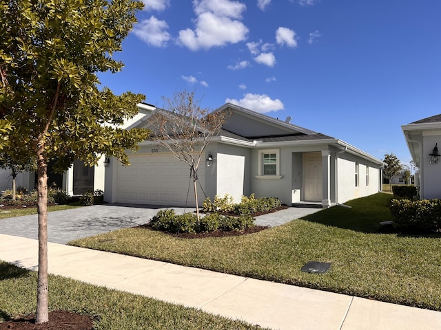 view of front of home with a garage and a front yard