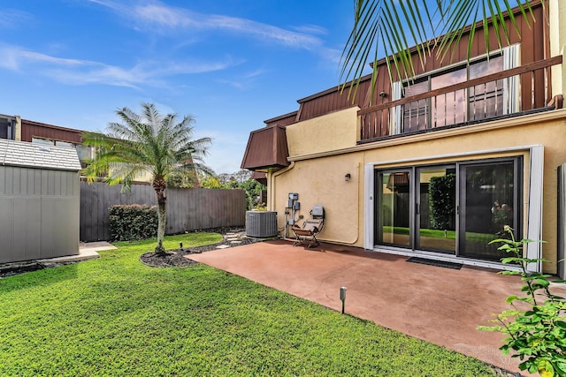 view of yard featuring central AC unit and a patio