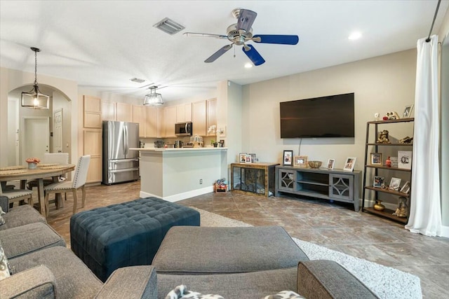 living room featuring ceiling fan