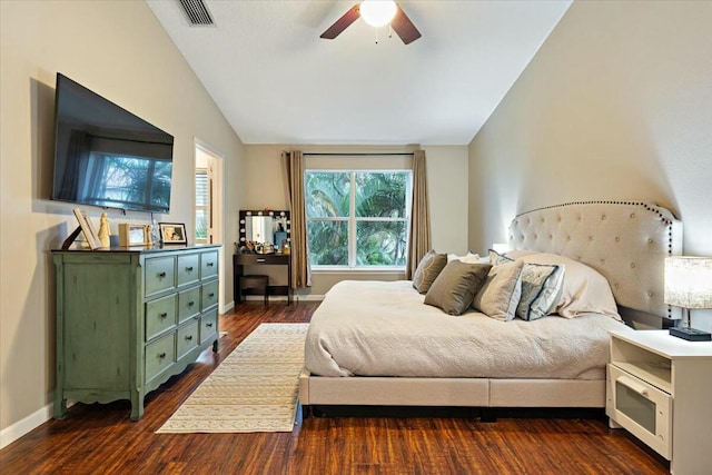 bedroom featuring lofted ceiling, dark wood-type flooring, and ceiling fan