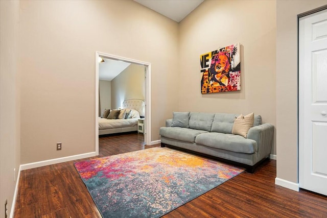 living room with dark hardwood / wood-style flooring