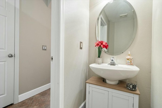 bathroom with vanity and tile patterned flooring