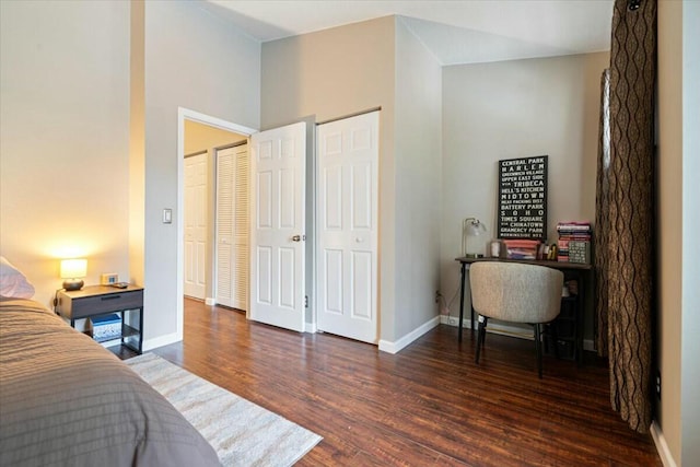 bedroom with dark wood-type flooring