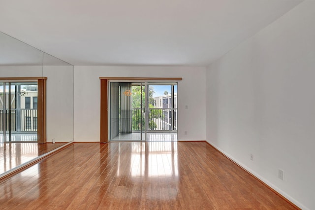 empty room with light hardwood / wood-style floors