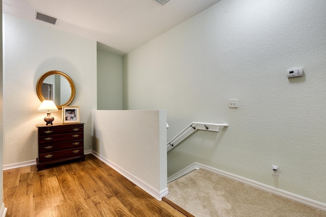 corridor featuring hardwood / wood-style floors