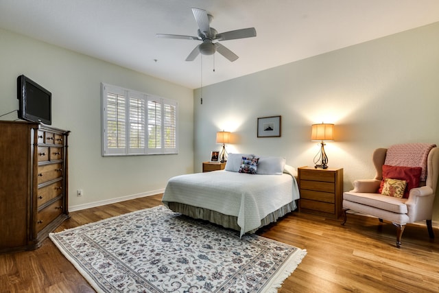 bedroom with ceiling fan and light hardwood / wood-style floors