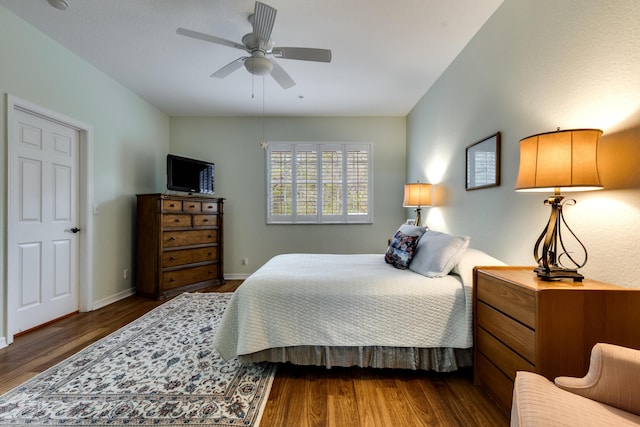 bedroom featuring dark hardwood / wood-style floors and ceiling fan