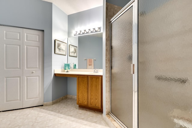 bathroom featuring vanity and an enclosed shower