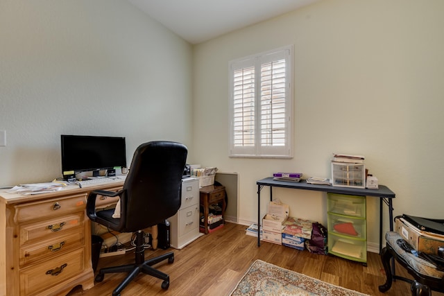 home office featuring hardwood / wood-style floors