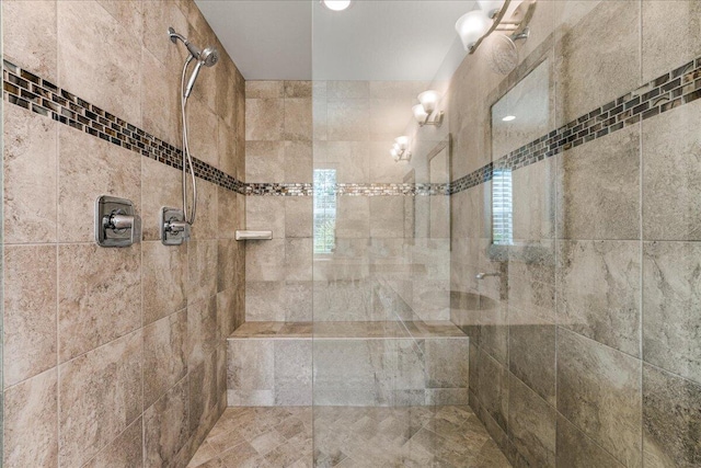 bathroom featuring a tile shower