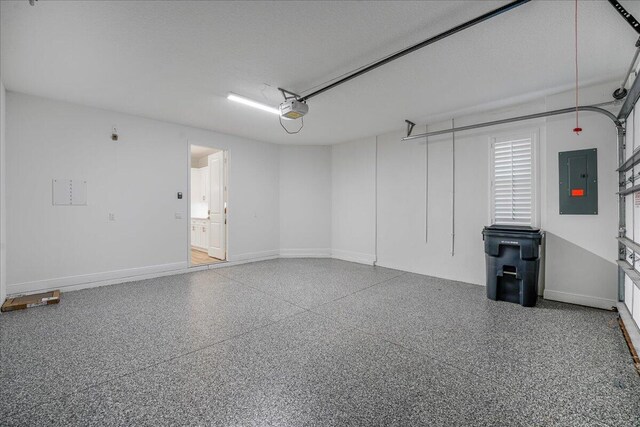 garage featuring a garage door opener and electric panel