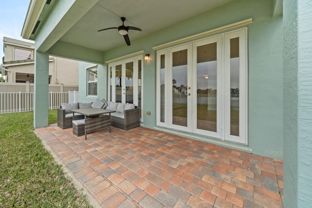 view of patio / terrace featuring outdoor lounge area, french doors, and ceiling fan