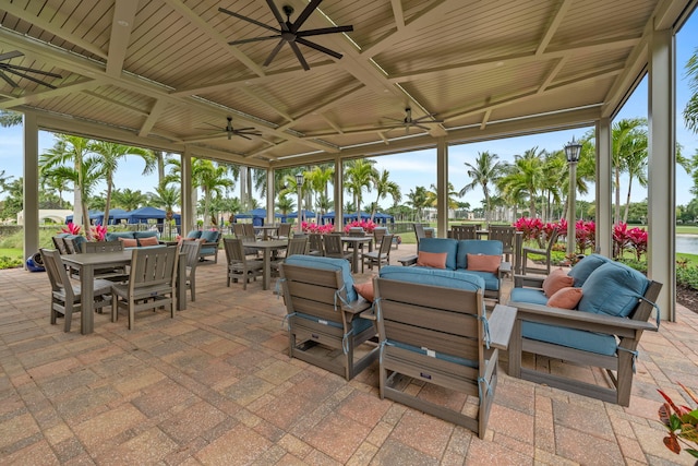 view of patio / terrace with an outdoor living space, a gazebo, and ceiling fan