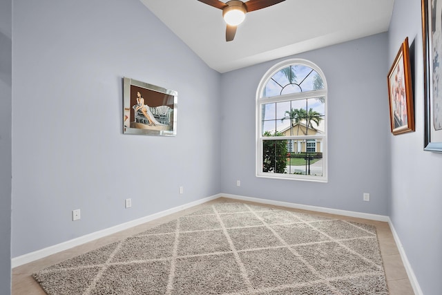 empty room featuring vaulted ceiling and ceiling fan