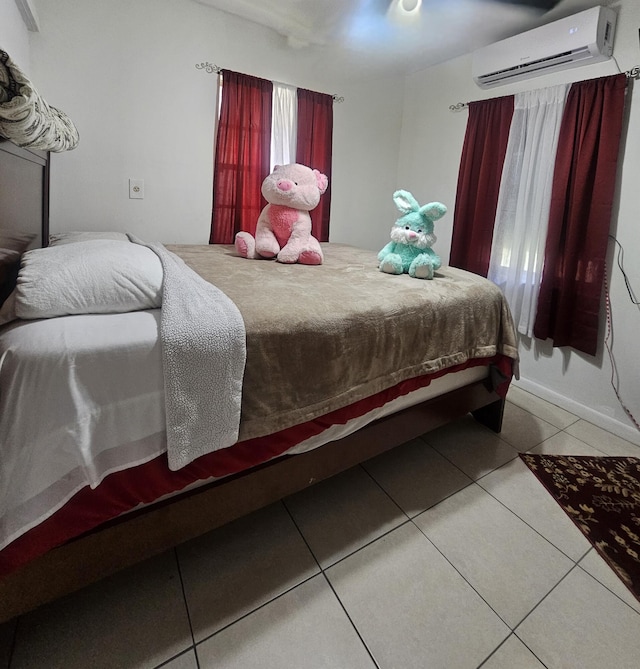 1105 Sunrise Blvd, Fort Pierce, FL 34950 - bedroom featuring a wall mounted air conditioner and tile patterned flooring