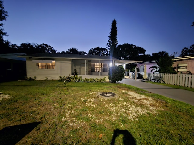 1105 Sunrise Blvd, Fort Pierce, FL 34950 - ranch-style home featuring concrete driveway, a front lawn, and fence