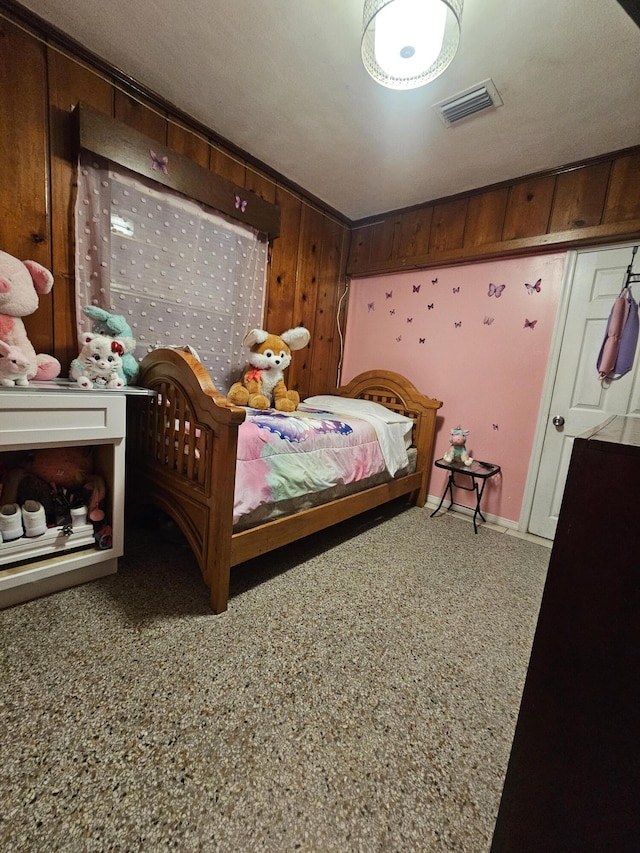 bedroom with wooden walls