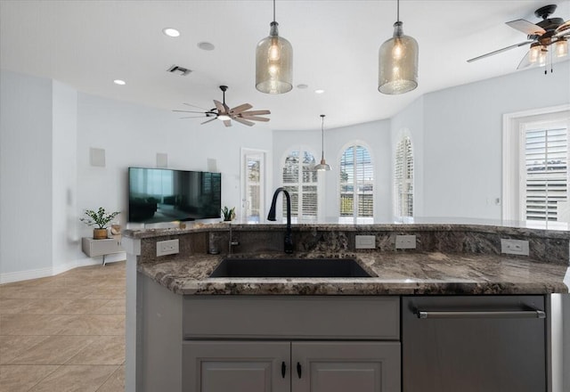 kitchen featuring sink, decorative light fixtures, and gray cabinets