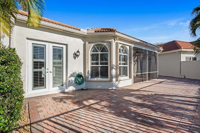 view of patio with a sunroom and french doors