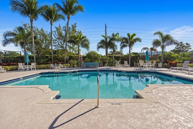 view of swimming pool featuring a patio