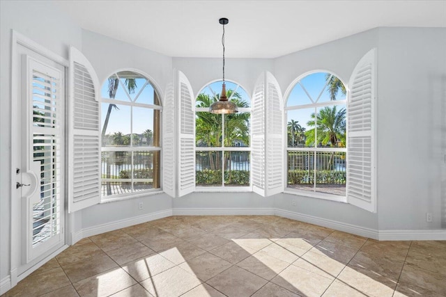 unfurnished dining area featuring light tile patterned floors