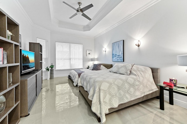 bedroom featuring ceiling fan, ornamental molding, and a raised ceiling