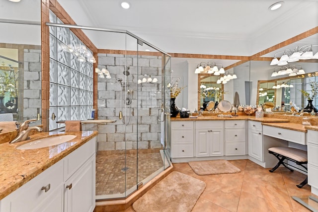 bathroom with vanity, tile patterned flooring, and a shower with door