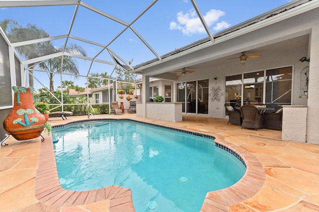 view of pool featuring ceiling fan, a lanai, and a patio