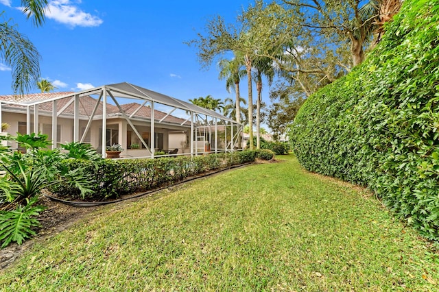 view of yard with a lanai