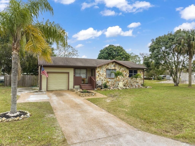 ranch-style home featuring a garage and a front lawn