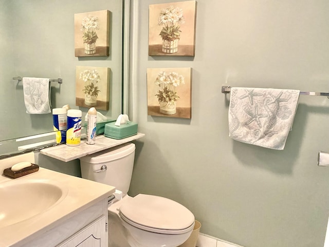 bathroom featuring vanity and toilet