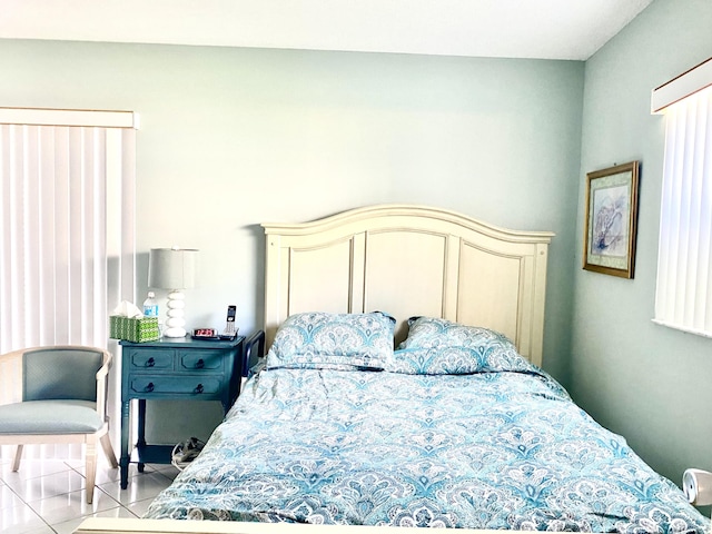 bedroom with light tile patterned floors