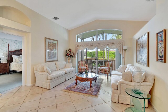 tiled living room with vaulted ceiling