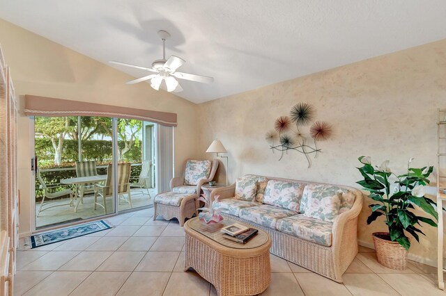 tiled living room with ceiling fan and lofted ceiling