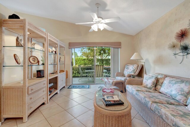 kitchen featuring stainless steel appliances, light tile patterned flooring, sink, and ceiling fan