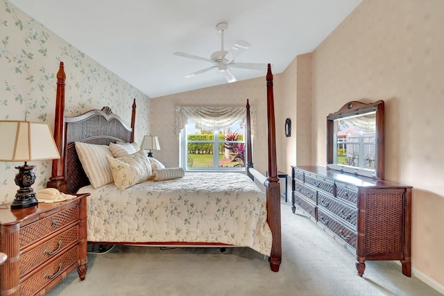 bedroom with ceiling fan, lofted ceiling, and light colored carpet